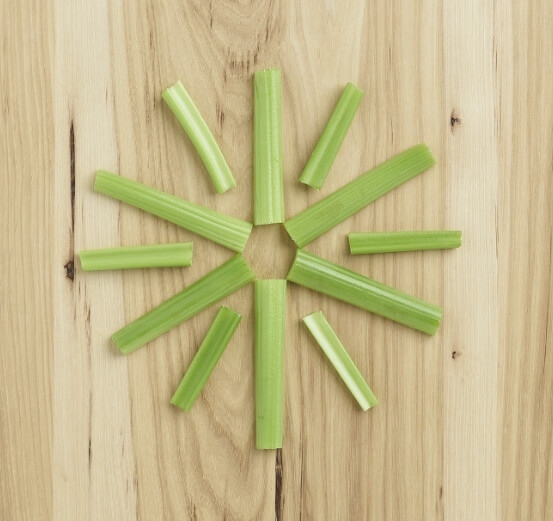 benefit-subhead celery on a wooden table